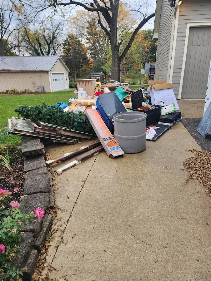 Dumpster being loaded with debris for Residential Dumpster Rental in Bucyrus